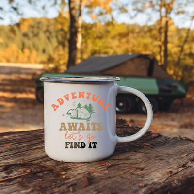 a white coffee mug sitting on top of a tree stump