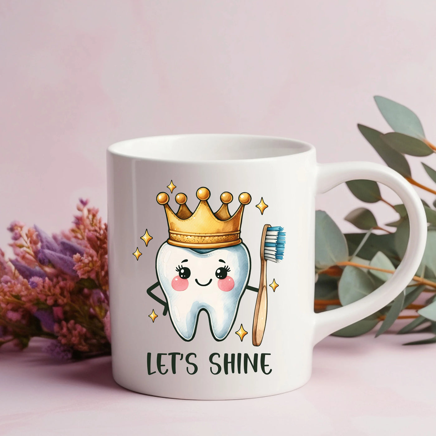 a coffee mug with a toothbrush and a crown on it