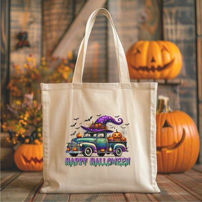 a trick or treat bag sitting on a table next to pumpkins