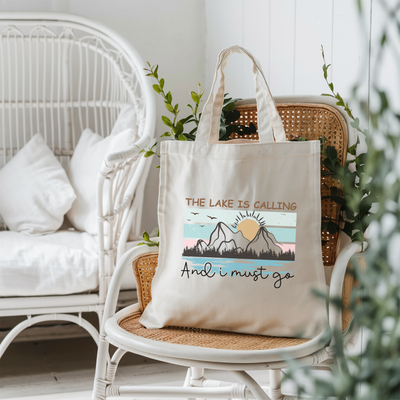 a tote bag sitting on top of a wicker chair