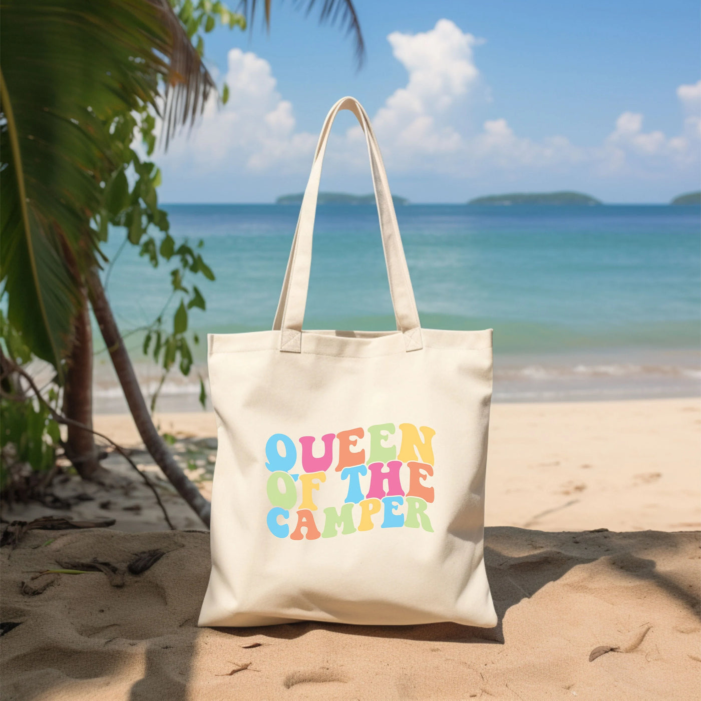 a white bag sitting on top of a sandy beach