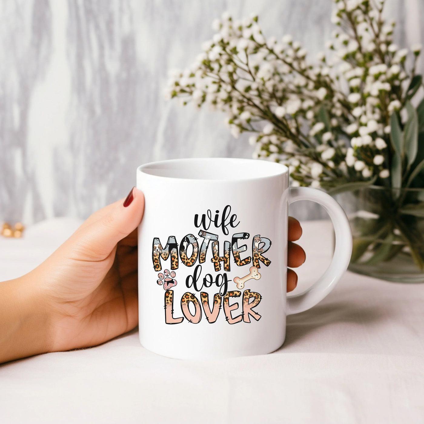 a woman holding a white coffee mug with the words wife on it