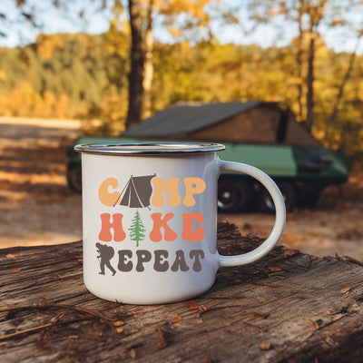 a camp mug sitting on top of a tree stump