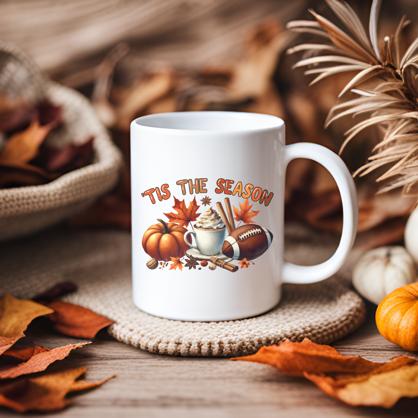 a white coffee mug sitting on top of a table