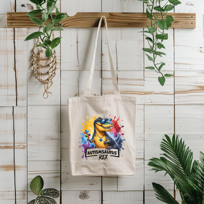 a tote bag hanging on a wall next to a potted plant