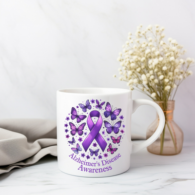 a coffee mug with a purple ribbon on it