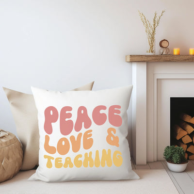 a pillow that says peace love and teaching