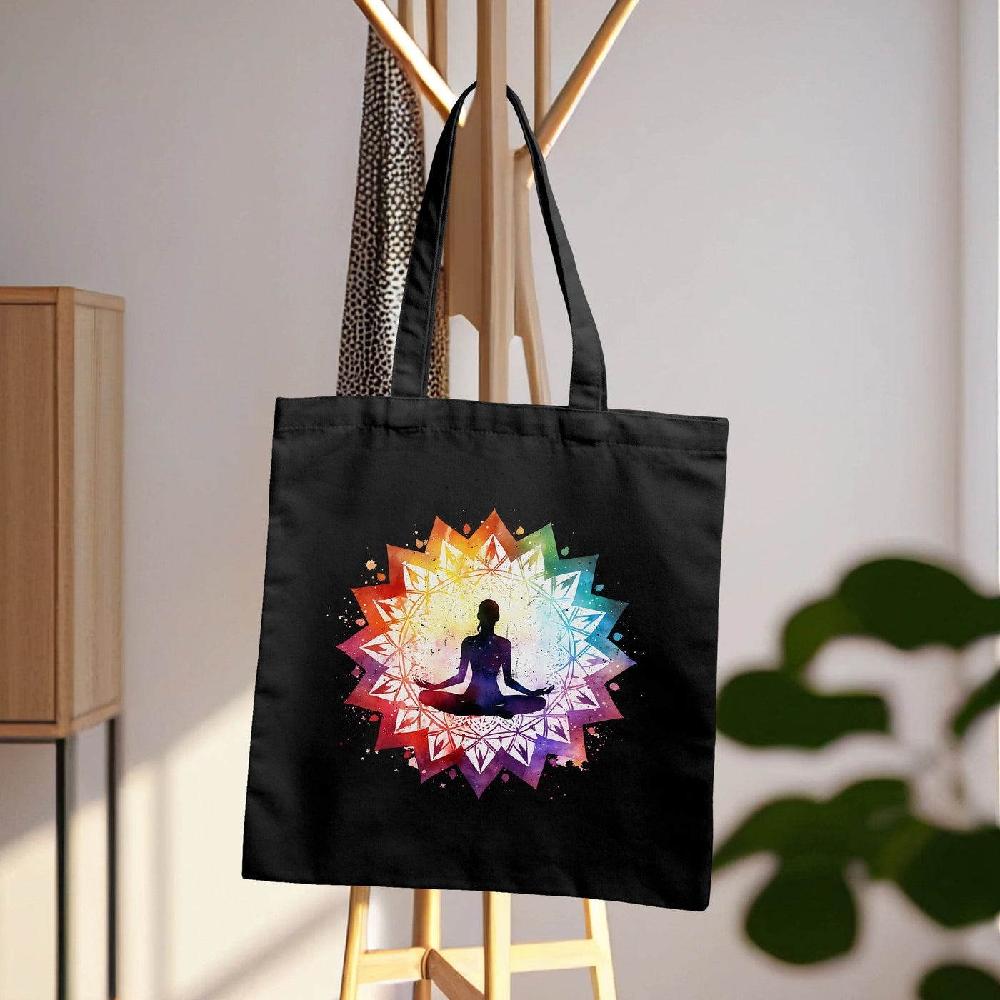 a black tote bag with a woman doing yoga