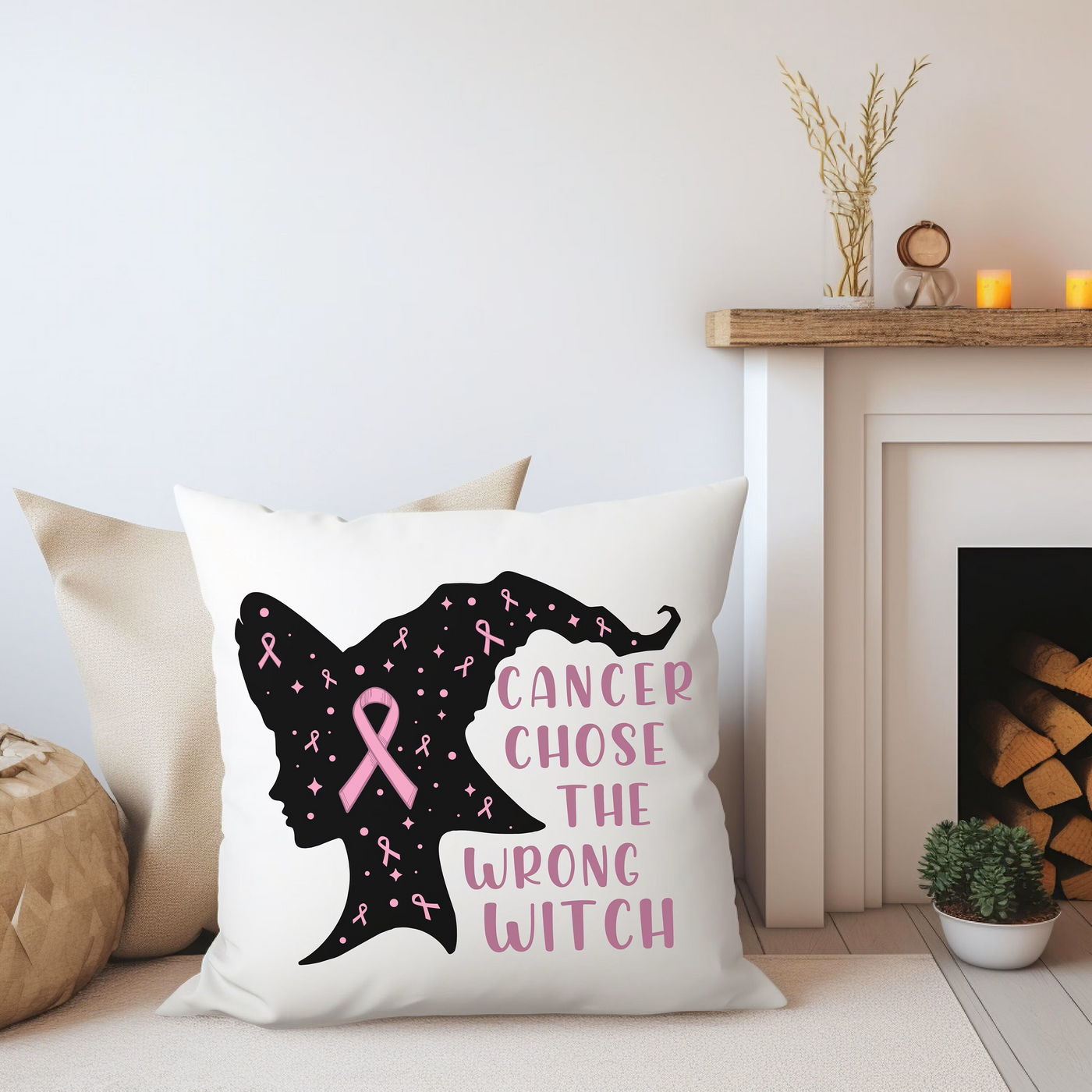 a pillow that has a pink ribbon on it