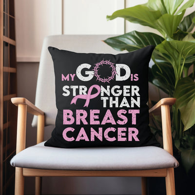 a chair with a pillow that says, my god is stronger than breast cancer