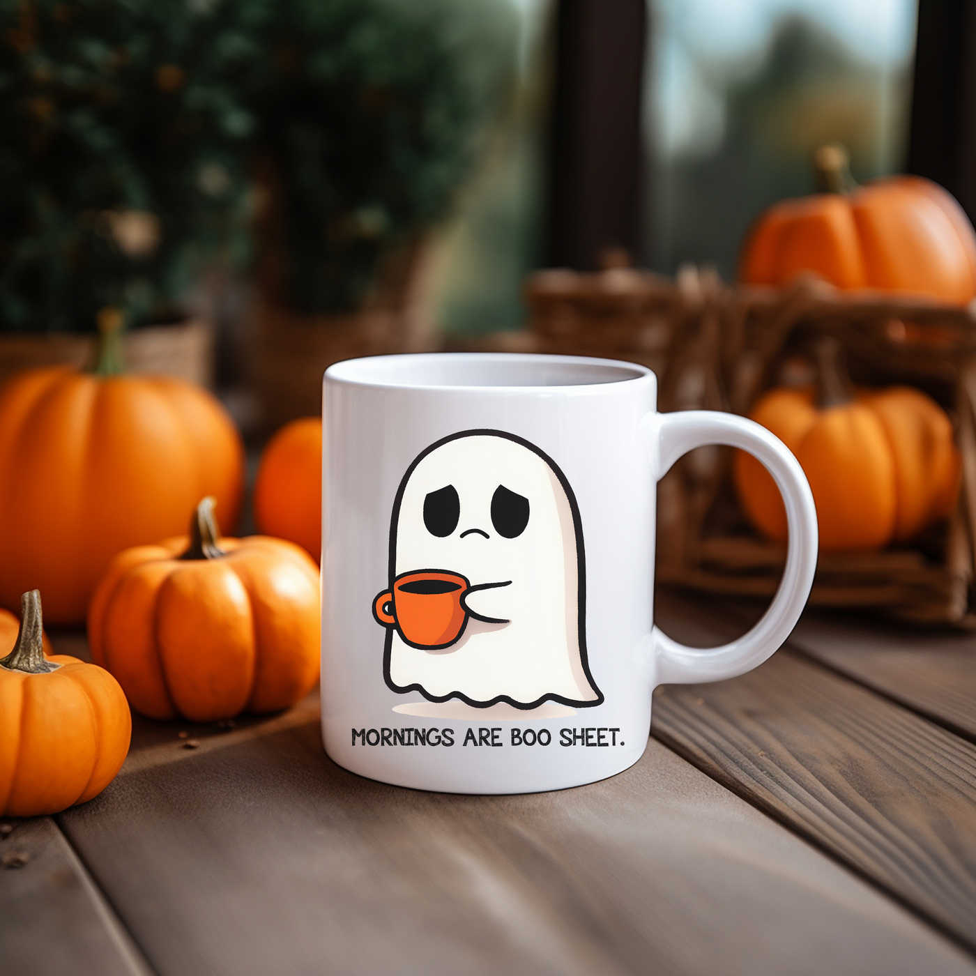 a white coffee mug with a ghost on it