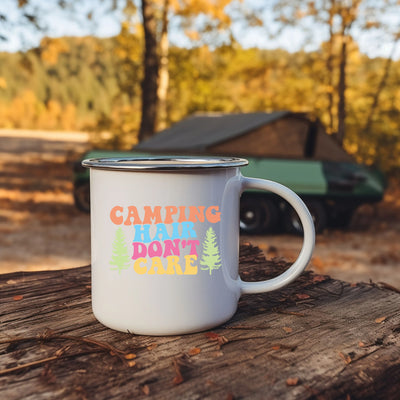 a camper mug sitting on top of a tree stump