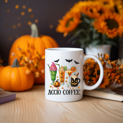 a coffee mug sitting on a table with pumpkins in the background