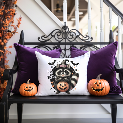 a bench with two pumpkins and a pillow on it