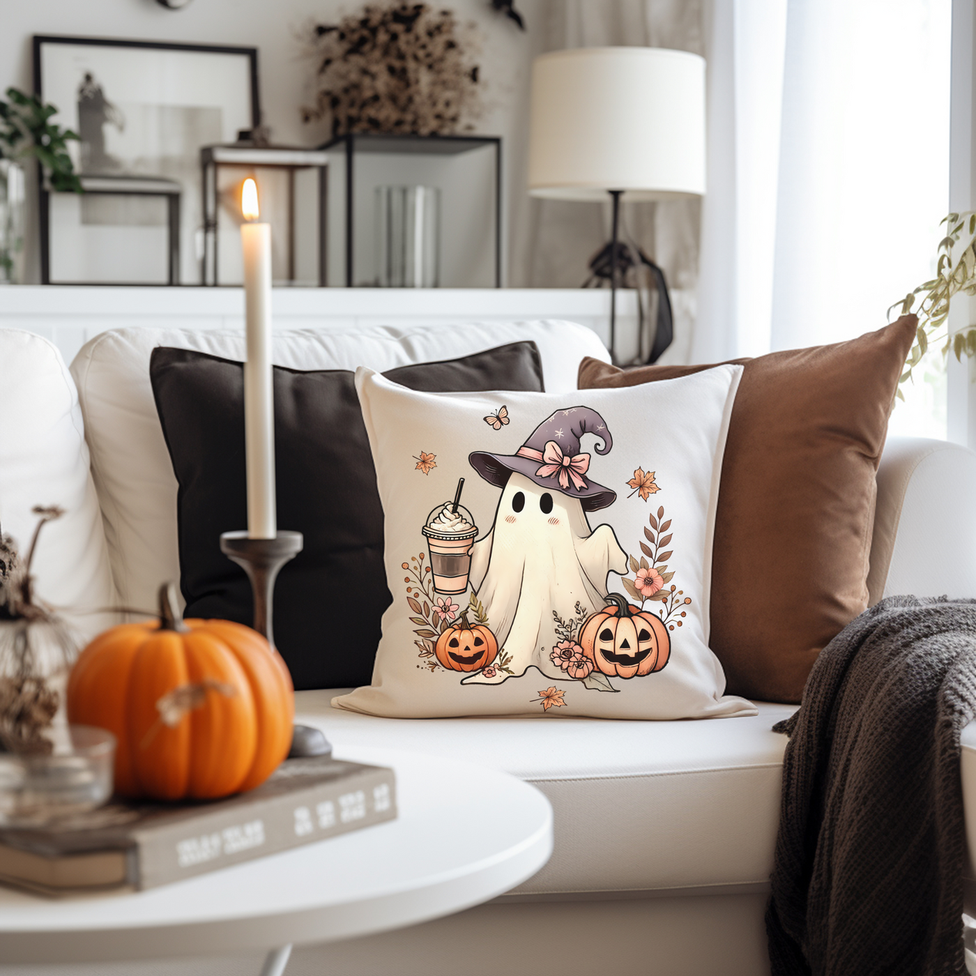 a white couch with a halloween pillow on it