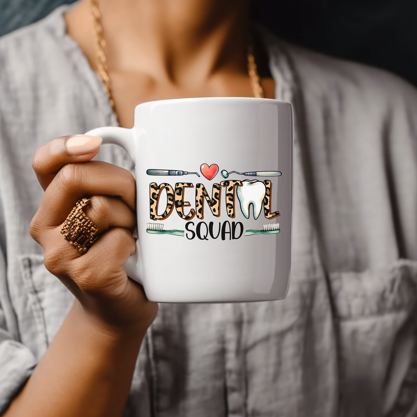 a woman holding a coffee mug with the word dandal on it