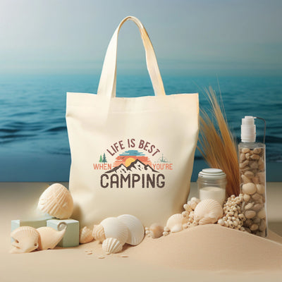 a white bag sitting on top of a sandy beach