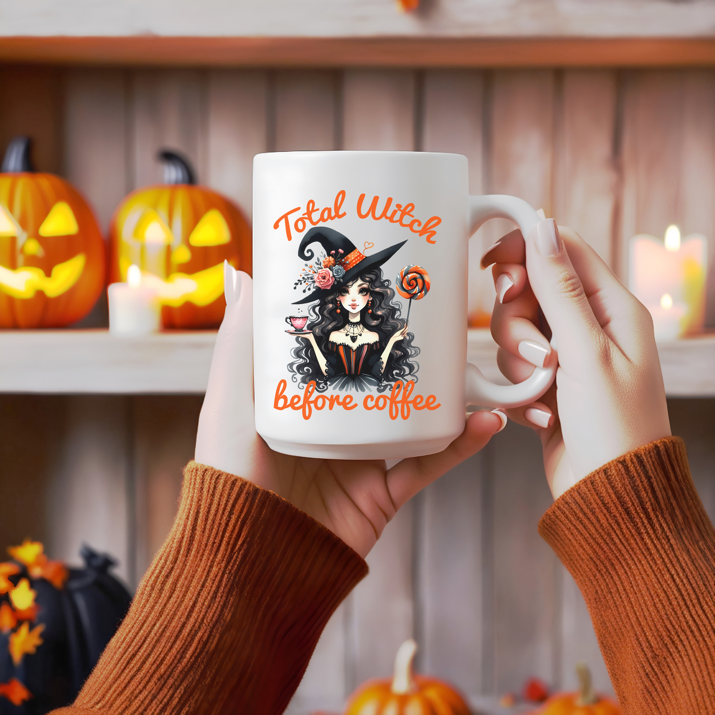 a woman holding a coffee mug with a witch on it