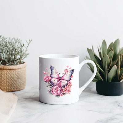 a white coffee mug with a pink butterfly on it