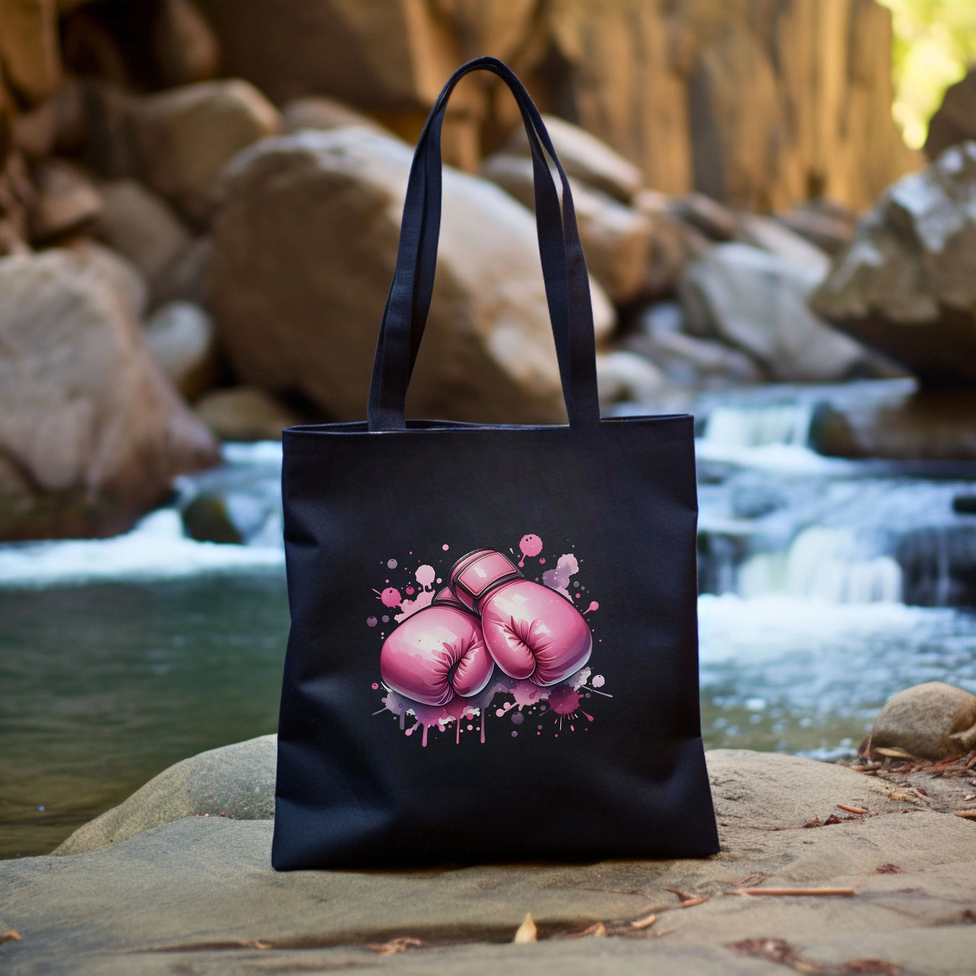 a black bag with pink boxing gloves on it