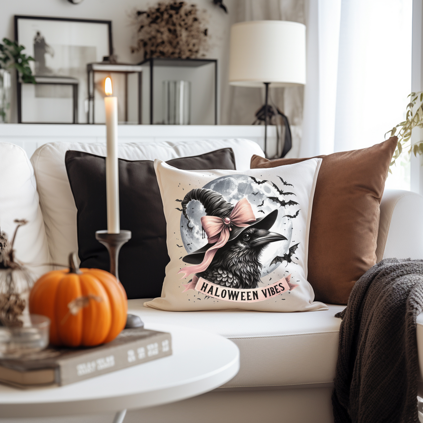 a white couch with a halloween pillow on it