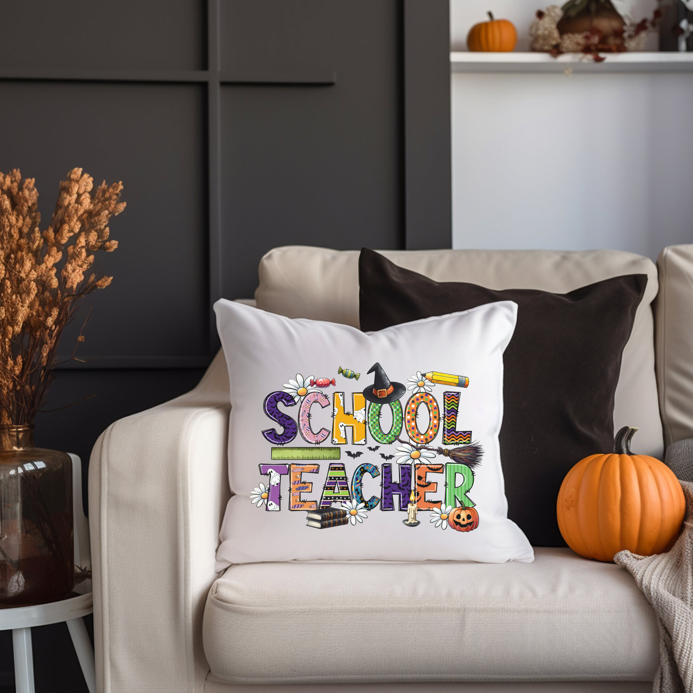 a school teacher pillow sitting on a couch