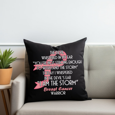 a black pillow with pink writing on it