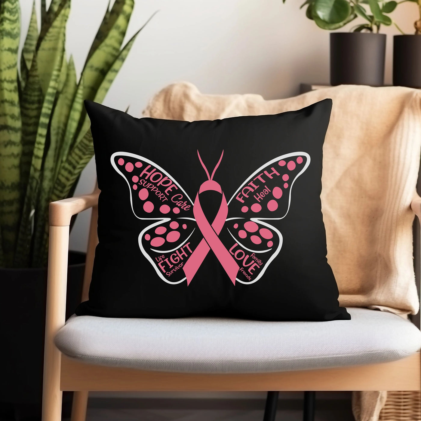 a black pillow with a pink butterfly on it