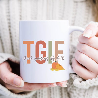 a woman holding a coffee mug with a turkey on it