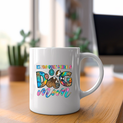 a white coffee mug sitting on top of a wooden table