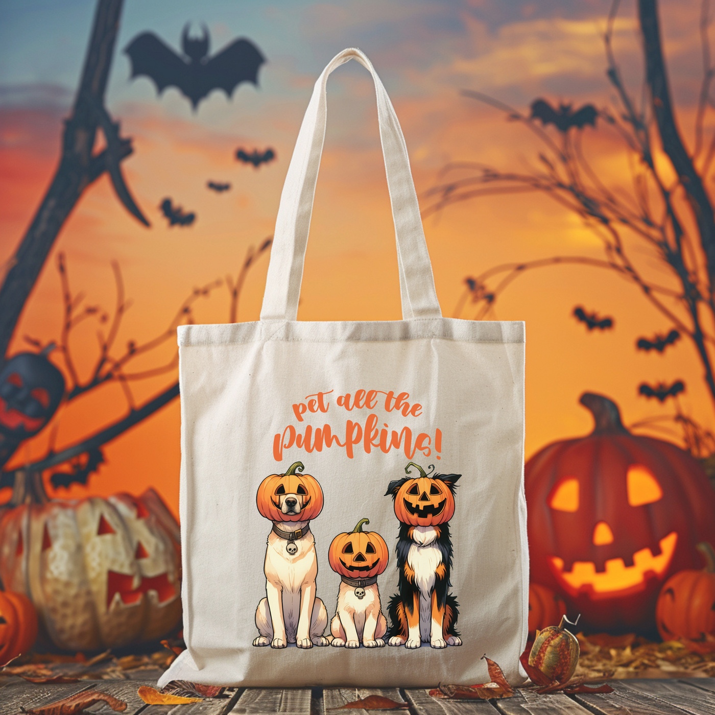 a white bag with two dogs wearing pumpkin hats