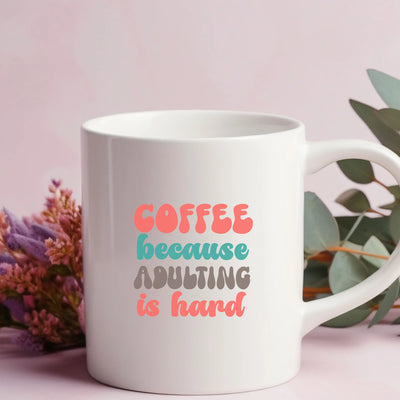 a coffee mug with the words coffee because adulting is hard