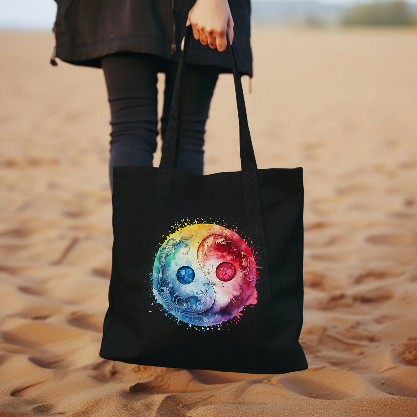 a woman carrying a black bag with a colorful skull on it