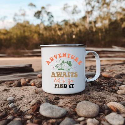 a white coffee mug sitting on top of a pile of rocks