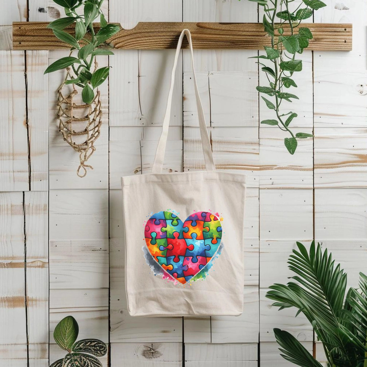 a tote bag with a heart made out of puzzle pieces