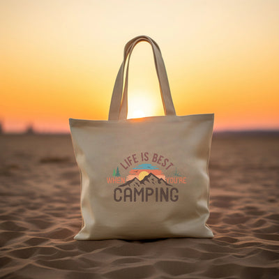 a white bag sitting on top of a sandy beach