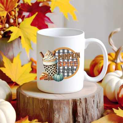 a white coffee mug sitting on top of a tree stump