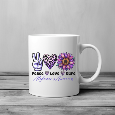 a white coffee mug with peace, love, and care written on it