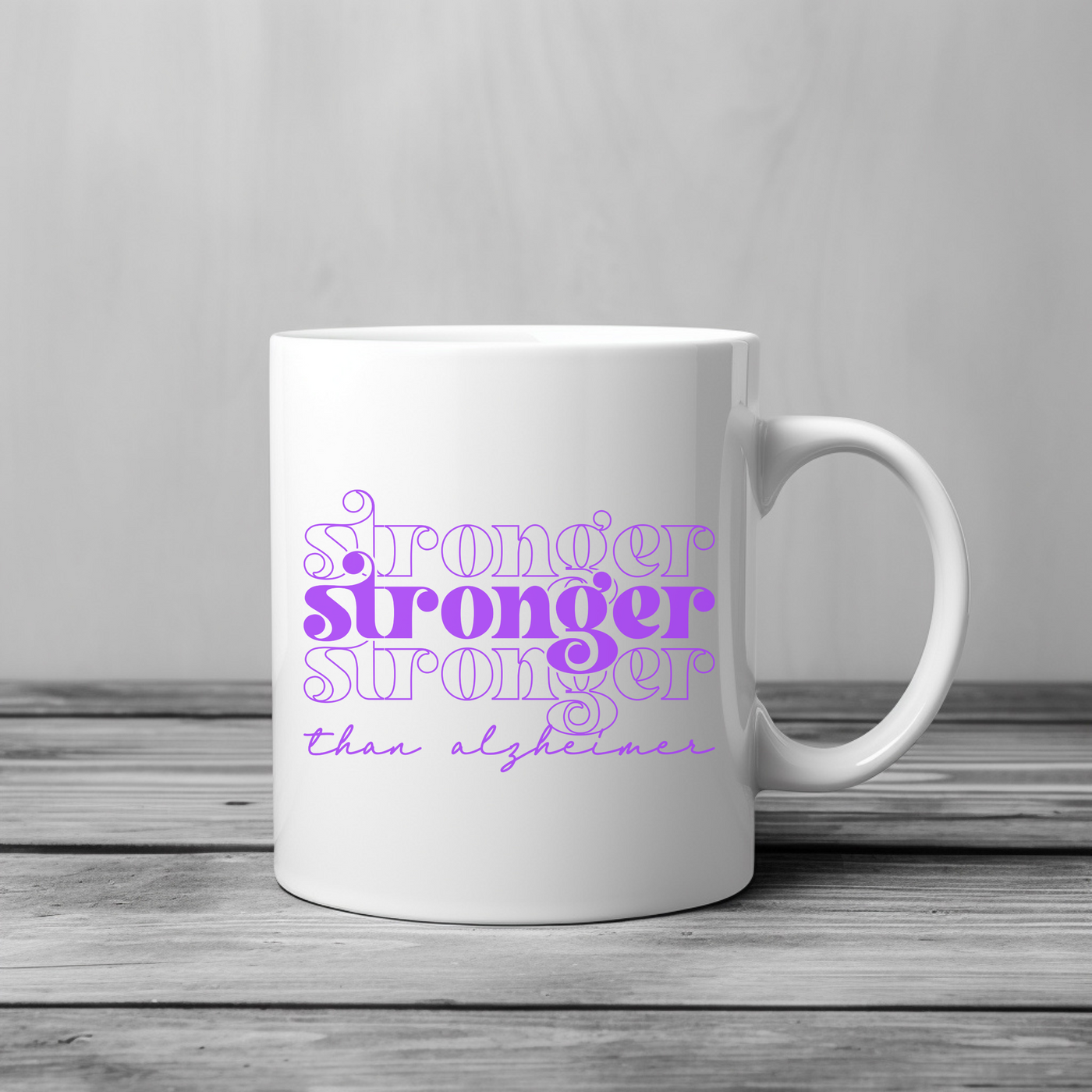 a white coffee mug with purple writing on it