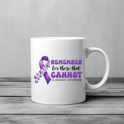 a white coffee mug with a purple ribbon on it