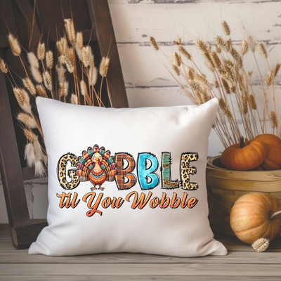 a white pillow with the words gobble at you wobble on it