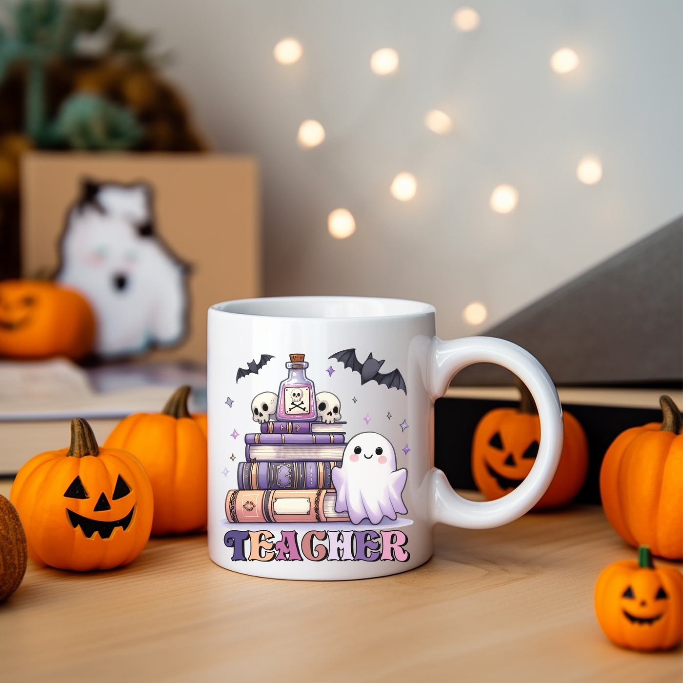 a white coffee mug with a picture of a stack of books and ghost on it