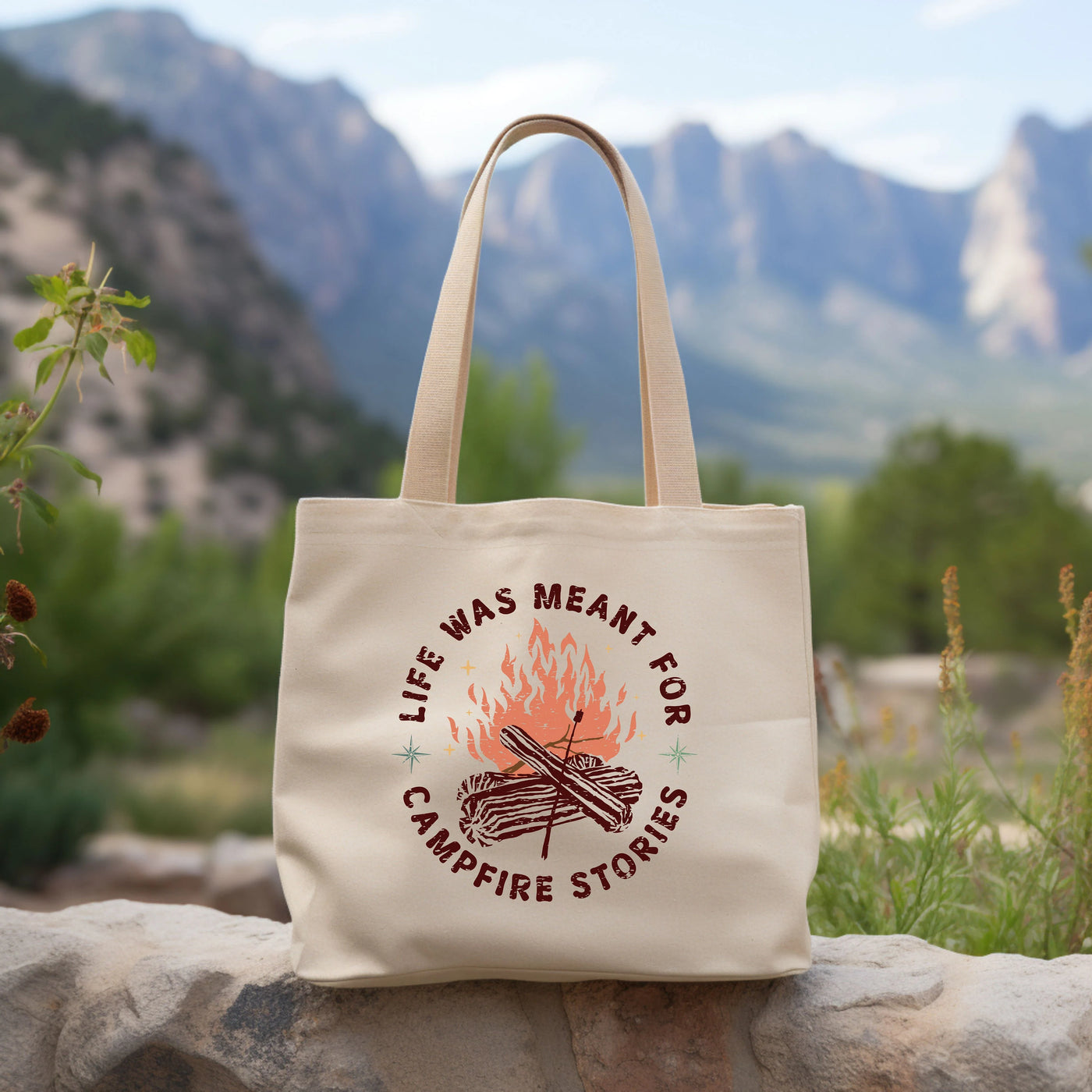 a tote bag sitting on top of a rock