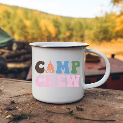 a camp mug sitting on top of a wooden table