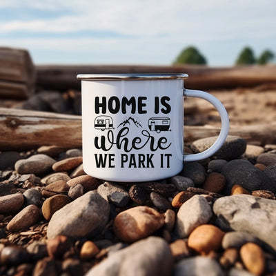 a camper mug sitting on top of a pile of rocks