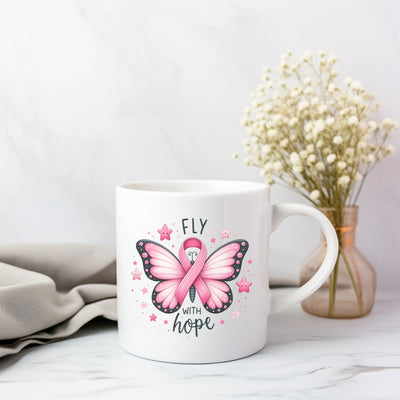 a white coffee mug with a pink butterfly on it