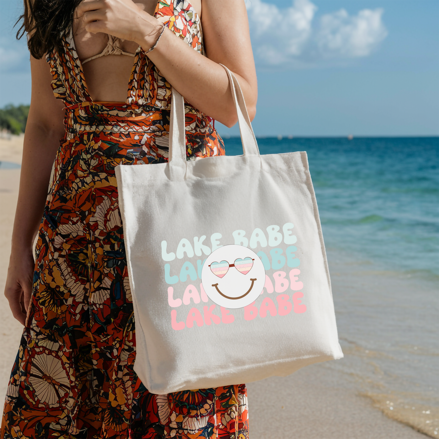 a woman holding a bag on the beach