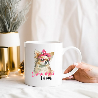 a person holding a coffee mug with a dog on it