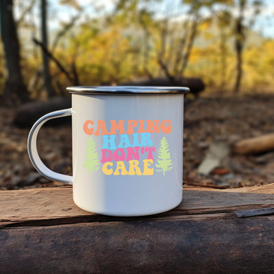 a camp mug sitting on top of a piece of wood