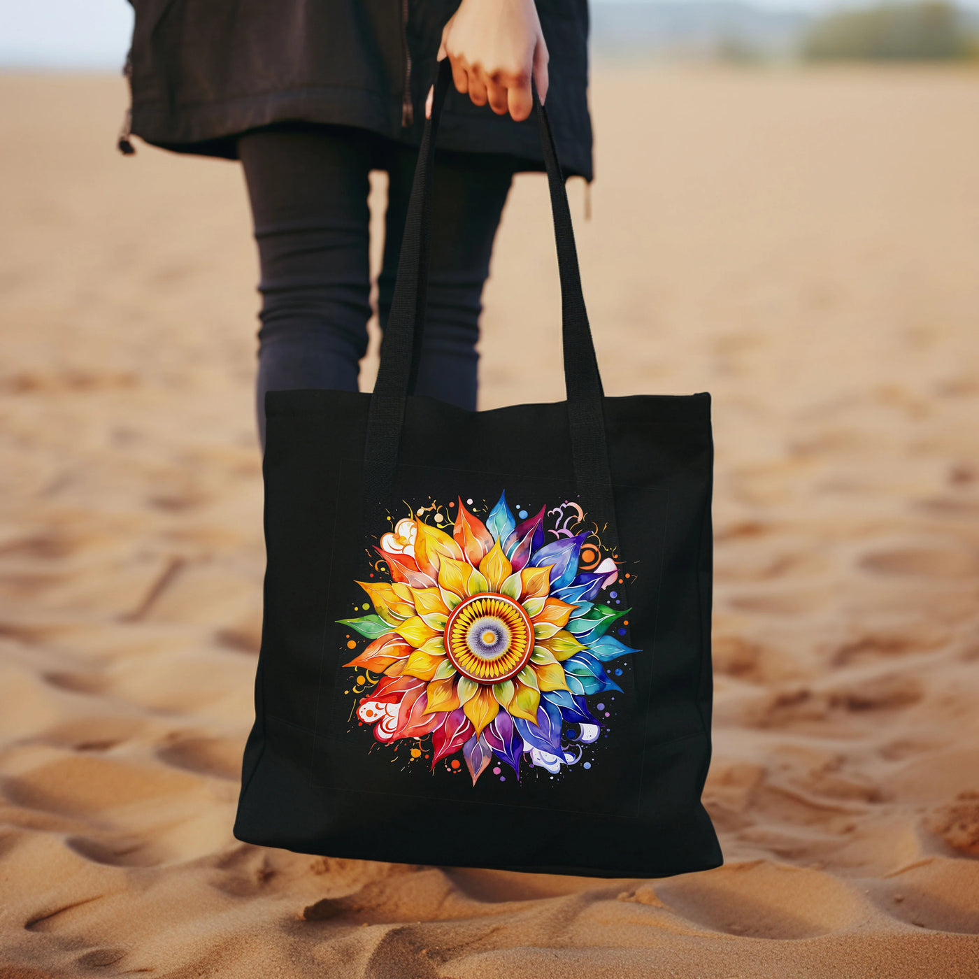 a woman carrying a black tote bag on a sandy beach